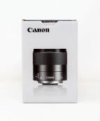 A boxed as new Canon EF-M 32mm f/1.4 STM Lens.
