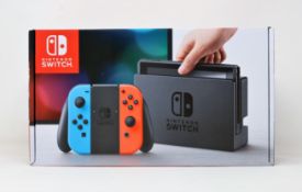 A boxed as new Nintendo Switch Console in Neon Red/Blue (M/N: HAD-S-KABAA-JPN) (Some packaging