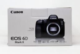 A boxed as new Canon EOS 6D MKII 26.2MP DSLR Camera (Body Only) (Two pin plug included).