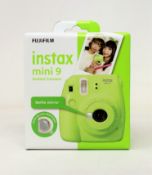A boxed as new Fujifilm Instax Mini 9 Instant Camera in Green.
