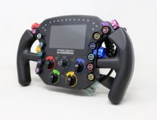 A boxed as new Precision Sim Engineering LM-X Steering Wheel with Dual Clutch Paddles and Quick