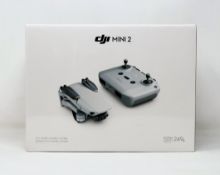 A boxed as new DJI Mini 2 Drone Fly More Combo Kit (UK model) (Box sealed).