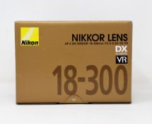 A boxed as new Nikon AF-S DX NIKKOR 18-300mm f/3.5-6.3G ED VR Lens.