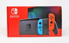 A boxed as new Nintendo Switch Console in Neon Red/Blue (M/N: HAD-S-KABAA-JPN) (Some packaging
