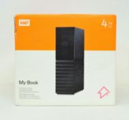 A boxed as new Western Digital WD 4TB My Book USB 3.0 Desktop Hard Drive (Box sealed).