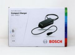 A boxed as new Bosch eBike Systems Compact Charger (100-240v 2a) (Box sealed).