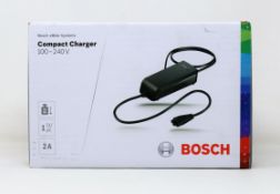 A boxed as new Bosch eBike Systems Compact Charger (100-240v 2a) (Box sealed).