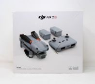 A boxed as new DJI Mavic Air 2S Drone Fly More Combo Kit (UK model) (Box sealed, damage to box).