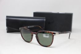 A pair of as new Persol sunglasses.