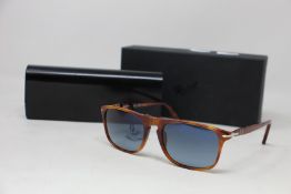 A pair of as new Persol sunglasses.