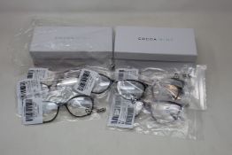 Seven pairs of as new Cocoa Mint glasses frames with two cases.