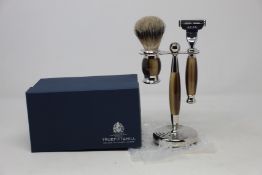 A boxed as new Truefitt & Hill Faux Horn Edwardian Shaving Set; Badger Brush, Mach III Razor and