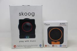 A boxed as new Skoog 'Play with Music' device and an as new Skoog Skwitch multi-use controller.