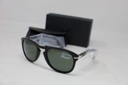 A pair of as new Persol folding sunglasses.