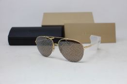 A pair of as new Burberry sunglasses.