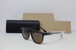 A pair of as new Burberry sunglasses.