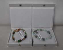 An as new Coeur De Lion Geo Cube Gree-Beige and Rose Bracelet 4905/30-0510 (RRP £95) and an as new