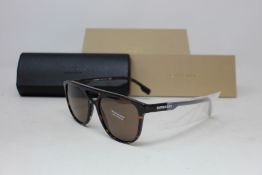 A pair of as new Burberry sunglasses.