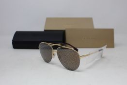 A pair of as new Burberry sunglasses.