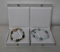 An as new Coeur De Lion Geo Cube Gree-Beige and Rose Bracelet 4905/30-0510 (RRP £95) and an as new