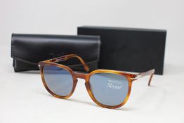 A pair of as new Persol sunglasses.