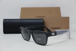 A pair of as new Burberry sunglasses.