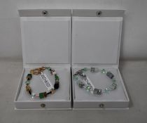 An as new Coeur De Lion Geo Cube Gree-Beige and Rose Bracelet 4905/30-0510 (RRP £95) and an as new