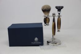 A boxed as new Truefitt & Hill Faux Horn Edwardian Shaving Set; Badger Brush, Mach III Razor and