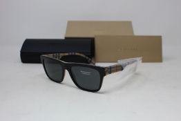 A pair of as new Burberry sunglasses.