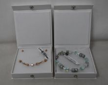 An as new Coeur De Lion Geo Cube Light Green Bracelet 4017/30-0520 (RRP £75) and an as new Coeur