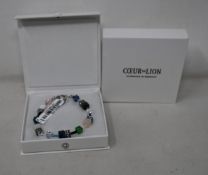 Two as new Coeur De Lion Blue Green Grey Mixed Geo Cube Bracelet 4905/30-0705 (RRP £95).