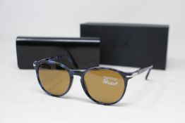 A pair of as new Persol sunglasses.