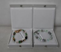 An as new Coeur De Lion Geo Cube Gree-Beige and Rose Bracelet 4905/30-0510 (RRP £95) and an as new