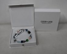 Two as new Coeur De Lion Blue Green Grey Mixed Geo Cube Bracelet 4905/30-0705 (RRP £95).