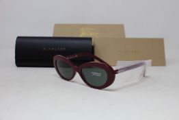 A pair of as new Burberry sunglasses.