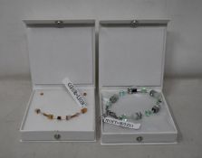 An as new Coeur De Lion Geo Cube Light Green Bracelet 4017/30-0520 (RRP £75) and an as new Coeur