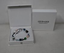 Two as new Coeur De Lion Blue Green Grey Mixed Geo Cube Bracelet 4905/30-0705 (RRP £95).
