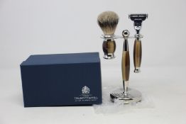 A boxed as new Truefitt & Hill Faux Horn Edwardian Shaving Set; Badger Brush, Mach III Razor and