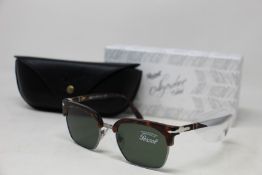 A pair of as new Persol Calligraphy Edition sunglasses.