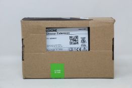 A boxed as new Loxone Dimmer Extension (Item no. 100029).