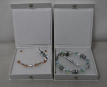 An as new Coeur De Lion Geo Cube Light Green Bracelet 4017/30-0520 (RRP £75) and an as new Coeur