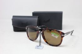 A pair of as new Persol folding sunglasses.