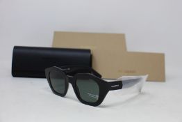A pair of as new Burberry sunglasses.