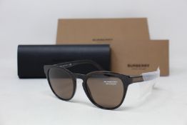 A pair of as new Burberry sunglasses.