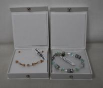 An as new Coeur De Lion Geo Cube Light Green Bracelet 4017/30-0520 (RRP £75) and an as new Coeur