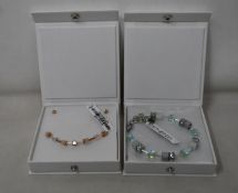 An as new Coeur De Lion Geo Cube Light Green Bracelet 4017/30-0520 (RRP £75) and an as new Coeur