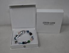 Two as new Coeur De Lion Blue Green Grey Mixed Geo Cube Bracelet 4905/30-0705 (RRP £95).