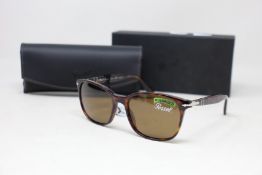 A pair of as new Persol sunglasses.
