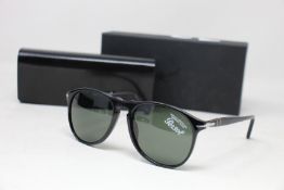 A pair of as new Persol sunglasses.