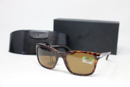 A pair of as new Persol sunglasses.